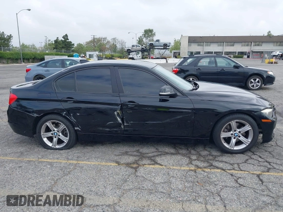 2014 BMW 3 Series 320i with VIN WBA3B1G57ENS80800, listed as a IAAI auction lot 42097683 with 152,924 mi miles. Bid and sale history available at carsss.com. Image 13.