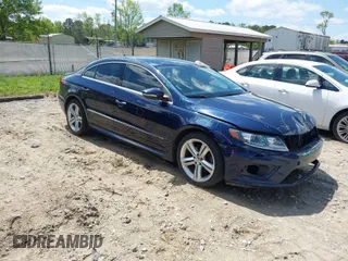 2014 Volkswagen CC R-Line with VIN WVWBP7AN7EE507463, listed as a IAAI auction lot 41984136 with 100,531 mi miles. Bid and sale history available at carsss.com. Image 1.