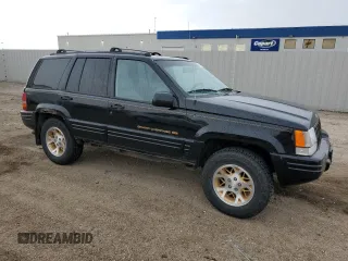 1997 Jeep Grand Cherokee Limited z VIN 1J4GZ78Y8VC586034, wystawiony jako Copart lot #58061705 z przebiegiem 244 355 mil mil oraz Czysty tytuł • Clean title. Historia ofert i sprzedaży dostępna na DreamBid. Obrazek 4.