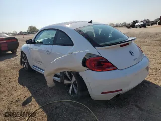 2012 Volkswagen Beetle 2.0T Turbo w/Sun/Sound with VIN 3VWV67AT5CM658403, listed as a Copart auction lot 71611614 with 10,878 mi miles and Salvage Title. Bid and sale history available at carsss.com. Image 2.