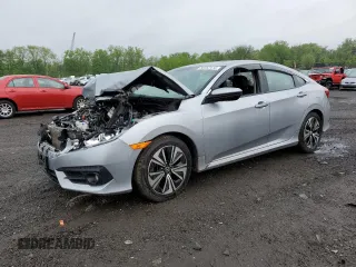 2017 Honda Civic EX-L z VIN 19XFC1F74HE209787, wystawiony jako Copart lot #56352415 z przebiegiem 130 264 mil mil oraz Szkoda całkowita • Salvage title. Historia ofert i sprzedaży dostępna na DreamBid. Obrazek 1.