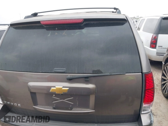 2014 Chevrolet Tahoe LT with VIN 1GNSCBE08ER106419, listed as a IAAI auction lot 41789896 with 99,420 mi miles and . Bid and sale history available at DreamBid. Image 16.