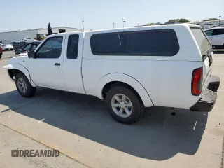 2001 Nissan Frontier XE with VIN 1N6DD26S71C385578, listed as a Copart auction lot 59875405 with 73,936 mi miles and Salvage title. Bid and sale history available at DreamBid. Image 2.