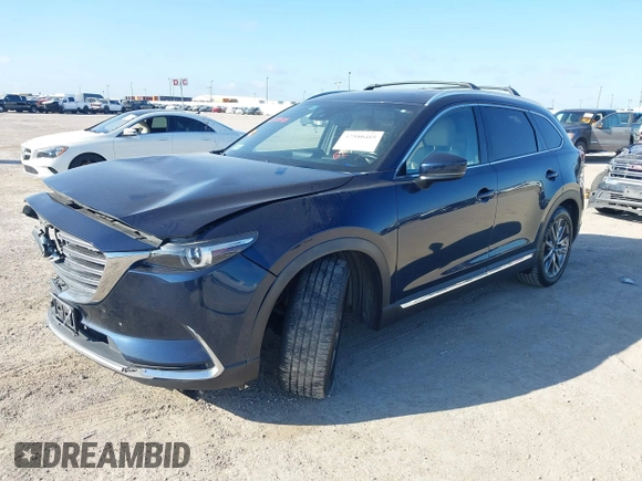 2016 Mazda CX-9 Grand Touring with VIN JM3TCADY6G0107064, listed as a IAAI auction lot 42580485 with 124,713 mi miles and . Bid and sale history available at DreamBid. Image 18.
