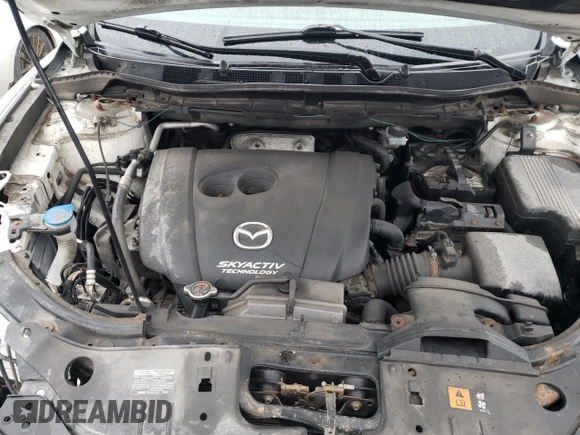 2014 Mazda CX-5 Touring z VIN JM3KE4CY1E0406726, wystawiony jako Copart lot #54652065 z przebiegiem 245 491 mil mil oraz Szkoda całkowita • Salvage title. Historia ofert i sprzedaży dostępna na DreamBid. Obrazek 12.