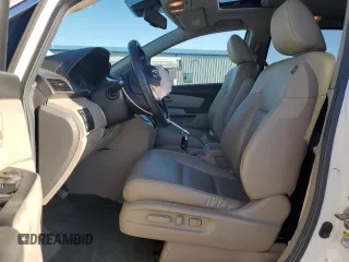 2014 Honda Odyssey EX-L with VIN 5FNRL5H61EB005740, listed as a Copart auction lot 54663595 with 118,971 mi miles and Salvage Title. Bid and sale history available at DreamBid. Image 7.