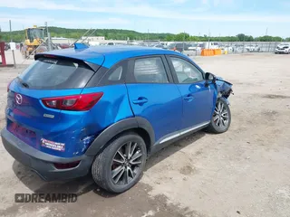 2016 Mazda CX-3 Grand Touring z VIN JM1DKFD78G0134173, wystawiony jako IAAI lot #42179942 z przebiegiem 93 539 mil mil oraz . Historia ofert i sprzedaży dostępna na DreamBid. Obrazek 4.