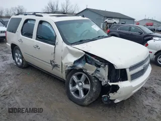 2013 Chevrolet Tahoe LTZ with VIN 1GNSKCE01DR154013, listed as a IAAI auction lot 41736297 with 215,081 mi miles and . Bid and sale history available at DreamBid. Image 1.