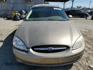 2003 Ford Taurus SES Standard z VIN 1FAFP55253G138373, wystawiony jako Copart lot #57124335 z przebiegiem 89 136 mil mil oraz Szkoda całkowita • Salvage title. Historia ofert i sprzedaży dostępna na DreamBid. Obrazek 5.