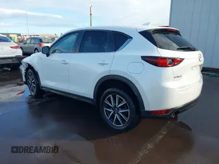 2018 Mazda CX-5 Touring with VIN JM3KFACM1J1431462, listed as a IAAI auction lot 41038099 with 77,489 mi miles. Bid and sale history available at carsss.com. Image 3.