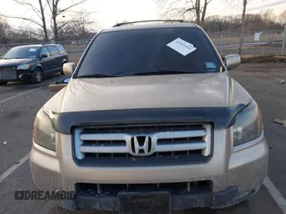 2007 Honda Pilot EX-L with VIN 2HKYF18667H509331, listed as a IAAI auction lot 41453510 with 228,746 mi miles and . Bid and sale history available at DreamBid. Image 12.