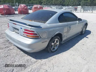1995 Ford Mustang with VIN 1FALP4047SF170414, listed as a IAAI auction lot 42079990 with 106,398 mi miles. Bid and sale history available at carsss.com. Image 4.