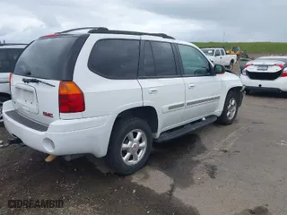2003 GMC Envoy SLE with VIN 1GKDS13S732101189, listed as a IAAI auction lot 41913632 with 245,889 mi miles. Bid and sale history available at carsss.com. Image 4.