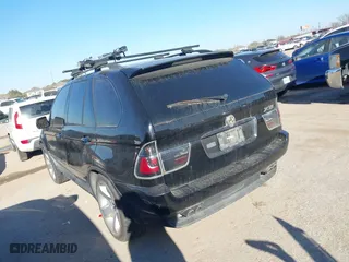 2004 BMW X5 4.4i with VIN 5UXFB53504LV06486, listed as a IAAI auction lot 41674534 with 164,974 mi miles. Bid and sale history available at carsss.com. Image 3.