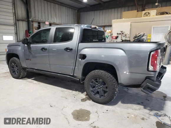 2022 GMC Canyon 4WD AT4 w/Leather with VIN 1GTG6FEN1N1175900, listed as a Copart auction lot 85957514 with 56,811 mi miles and Salvage Title. Bid and sale history available at carsss.com. Image 2.