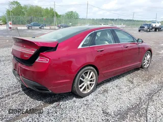 2014 Lincoln MKZ z VIN 3LN6L2G97ER811198, wystawiony jako IAAI lot #42132804 z przebiegiem 108 720 mil mil oraz . Historia ofert i sprzedaży dostępna na DreamBid. Obrazek 4.