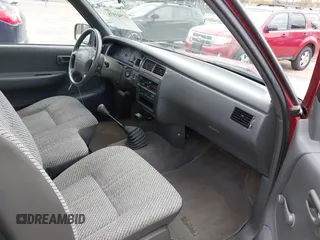1995 Toyota T100 DX with VIN JT4VD12E6S0005957, listed as a IAAI auction lot 41943578 with 128,489 mi miles. Bid and sale history available at carsss.com. Image 5.