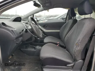 2011 Toyota Yaris with VIN JTDJT4K37B5339113, listed as a Copart auction lot 82474554 with 148,800 mi miles and Salvage Title. Bid and sale history available at carsss.com. Image 7.