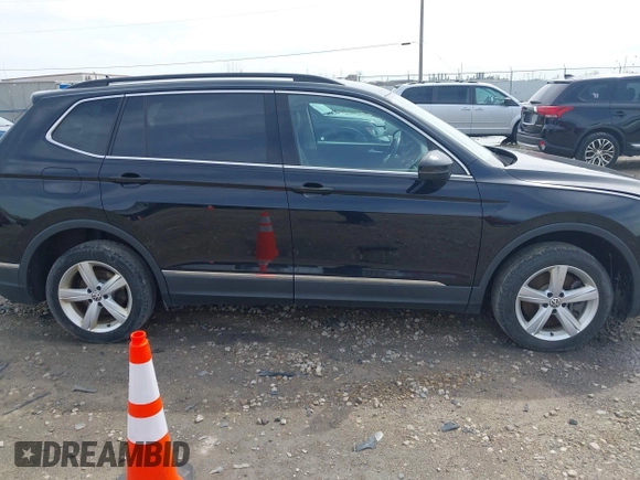 2021 Volkswagen Tiguan SE with VIN 3VV2B7AX4MM050282, listed as a IAAI auction lot 42124808 with 80,082 mi miles and . Bid and sale history available at DreamBid. Image 14.