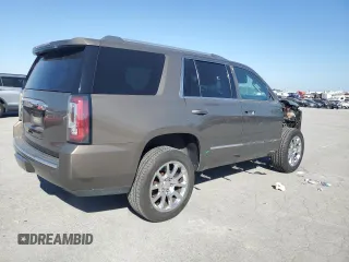 2015 GMC Yukon Denali with VIN 1GKS1CKJ2FR665259, listed as a Copart auction lot 75829894 with 193,376 mi miles and Salvage Title. Bid and sale history available at carsss.com. Image 3.