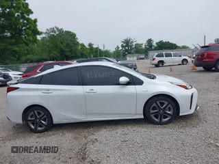 2021 Toyota Prius L Eco with VIN JTDKAMFU6M3137679, listed as a IAAI auction lot 42488129 with 52,414 mi miles and . Bid and sale history available at DreamBid. Image 14.