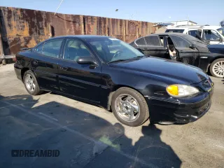 2002 Pontiac Grand Am GT with VIN 1G2NW52E12M704539, listed as a Copart auction lot 73755214 with 100,904 mi miles and Clean Title. Bid and sale history available at carsss.com. Image 4.