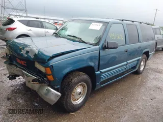 1995 GMC Suburban with VIN 1GDFK16K8SJ741041, listed as a IAAI auction lot 42315676 with 159,312 mi miles and . Bid and sale history available at DreamBid. Image 2.