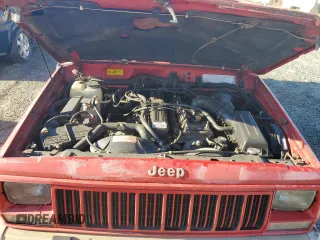 1993 Jeep Cherokee z VIN 1J4FT78S9PL634409, wystawiony jako Copart lot #77034984 z przebiegiem 146 585 mil mil oraz Szkoda całkowita • Salvage title. Historia ofert i sprzedaży dostępna na DreamBid. Obrazek 11.