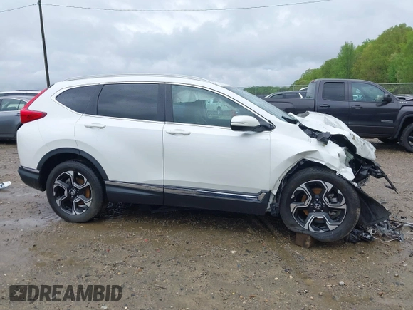 2018 Honda CR-V Touring z VIN 5J6RW1H96JL014087, wystawiony jako IAAI lot #41931640 z przebiegiem Nie podano mil oraz . Historia ofert i sprzedaży dostępna na DreamBid. Obrazek 14.