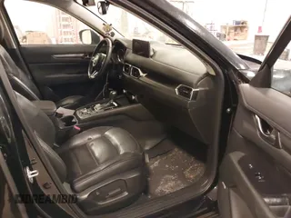 2021 Mazda CX-5 Touring with VIN JM3KFBCM1M1380409, listed as a IAAI auction lot 41677537 with 55,319 mi miles. Bid and sale history available at carsss.com. Image 5.