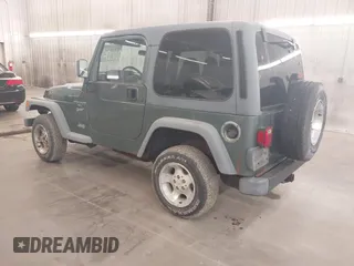 1999 Jeep Wrangler Sport with VIN 1J4FY19S0XP496555, listed as a IAAI auction lot 42110414 with 125,500 mi miles. Bid and sale history available at carsss.com. Image 3.
