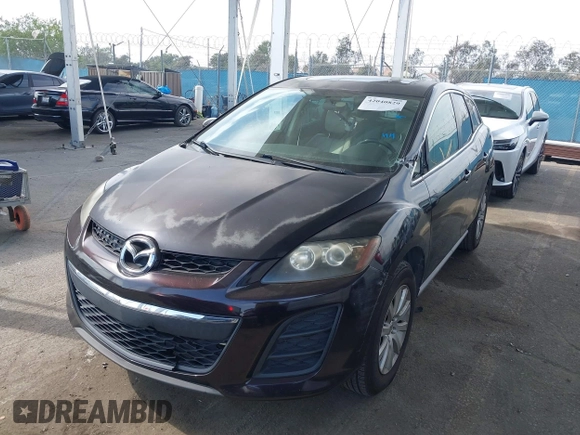 2011 Mazda CX-7 i Touring with VIN JM3ER2CM0B0402889, listed as a IAAI auction lot 42040829 with 134,836 mi miles. Bid and sale history available at carsss.com. Image 2.