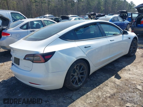 2023 Tesla Model 3 Long Range with VIN 5YJ3E1EB1PF393565, listed as a IAAI auction lot 41656060 with 16,236 mi miles and . Bid and sale history available at DreamBid. Image 4.