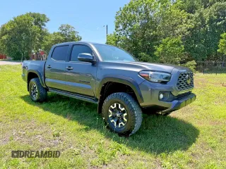 2021 Toyota Tacoma SR z VIN 3TMCZ5AN3MM441215, wystawiony jako Copart lot #61934125 z przebiegiem 30 498 mil mil oraz Szkoda całkowita • Salvage title. Historia ofert i sprzedaży dostępna na DreamBid. Obrazek 1.