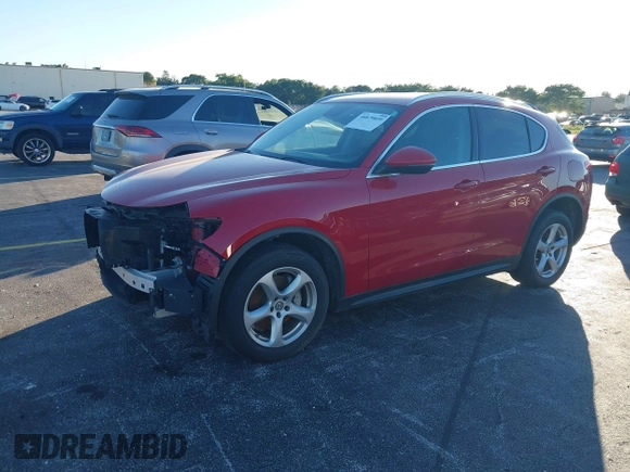 2018 Alfa Romeo Stelvio z VIN ZASFAKAN3J7C20066, wystawiony jako IAAI lot #40879859 z przebiegiem 50 131 mil mil oraz . Historia ofert i sprzedaży dostępna na DreamBid. Obrazek 2.