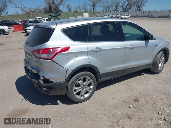 2013 Ford Escape SEL with VIN 1FMCU9H91DUA14749, listed as a IAAI auction lot 42039685 with 186,669 mi miles. Bid and sale history available at carsss.com. Image 4.