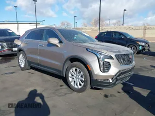 2023 Cadillac XT4 FWD Luxury with VIN 1GYAZAR40PF135132, listed as a IAAI auction lot 41684609 with 12,164 mi miles. Bid and sale history available at carsss.com. Image 1.