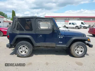 2002 Jeep Wrangler X z VIN 1J4FA39S82P735794, wystawiony jako IAAI lot #42411386 z przebiegiem 141 219 mil mil oraz . Historia ofert i sprzedaży dostępna na DreamBid. Obrazek 14.