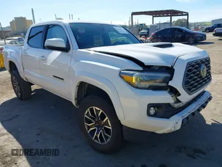 2020 Toyota Tacoma SR5 z VIN 3TMAZ5CN2LM117515, wystawiony jako IAAI lot #41630150 z przebiegiem 201 762 mil mil oraz . Historia ofert i sprzedaży dostępna na DreamBid. Obrazek 1.