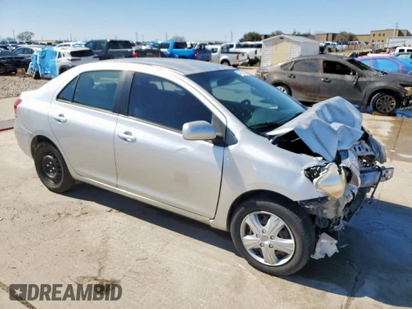 2012 Toyota Yaris with VIN JTDBT4K33C1416217, listed as a Copart auction lot 46714115 with 212,894 mi miles and Salvage Title. Bid and sale history available at DreamBid. Image 4.