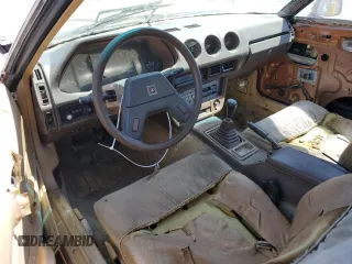 1982 Datsun 280ZX z VIN JN1HZ04S0CX433451, wystawiony jako Copart lot #53912864 z przebiegiem 200 629 mil mil oraz Tytuł czysty. Historia ofert i sprzedaży dostępna na DreamBid. Obrazek 8.