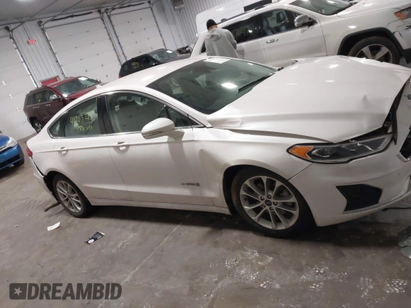 2019 Ford Fusion Hybrid SEL with VIN 3FA6P0MU8KR272811, listed as a IAAI auction lot 41705282 with 56,565 mi miles. Bid and sale history available at carsss.com. Image 13.