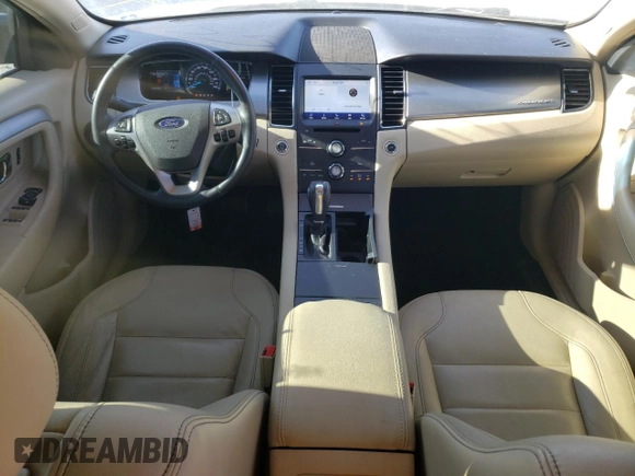 2015 Ford Taurus SEL with VIN 1FAHP2E90FG148821, listed as a Copart auction lot 77557384 with 141,514 mi miles and Salvage Title. Bid and sale history available at DreamBid. Image 8.