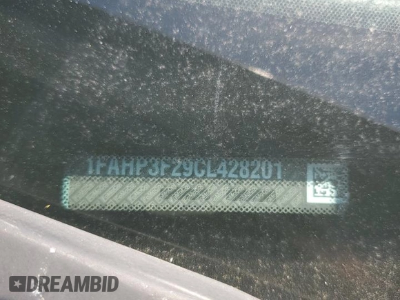 2012 Ford Focus SE with VIN 1FAHP3F29CL428201, listed as a Copart auction lot 52566905 with 209,909 mi miles and Salvage title. Bid and sale history available at DreamBid. Image 12.