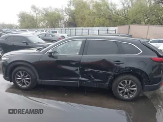 2016 Mazda CX-9 Touring with VIN JM3TCBCY5G0101490, listed as a IAAI auction lot 42062846 with 85,352 mi miles and . Bid and sale history available at DreamBid. Image 14.