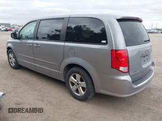 2014 Dodge Grand Caravan American Value with VIN 2C4RDGBG0ER168085, listed as a IAAI auction lot 42020959 with 213,383 mi miles and . Bid and sale history available at DreamBid. Image 3.