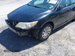 2014 Toyota Camry L with VIN 4T4BF1FK9ER408973, listed as a IAAI auction lot 42074491 with 183,934 mi miles and . Bid and sale history available at DreamBid. Image 17.