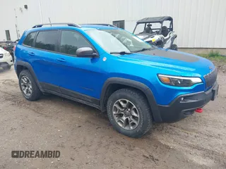 2021 Jeep Cherokee Trailhawk with VIN 1C4PJMBXXMD173102, listed as a IAAI auction lot 42205402 with 57,321 mi miles and . Bid and sale history available at DreamBid. Image 1.