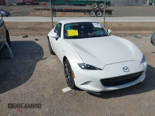 2020 Mazda MX-5 Miata Grand Touring with VIN JM1NDAM73L0414658, listed as a IAAI auction lot 42451595 with 73,339 mi miles and . Bid and sale history available at DreamBid. Image 1.