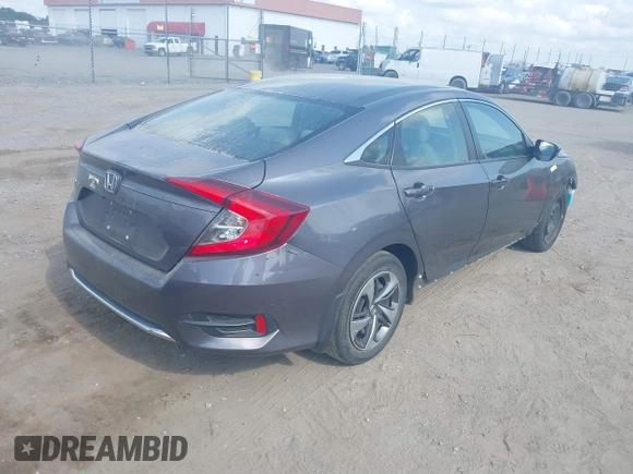 2020 Honda Civic LX with VIN 2HGFC2F65LH505932, listed as a IAAI auction lot 40046863 with 59,768 mi miles and . Bid and sale history available at DreamBid. Image 4.